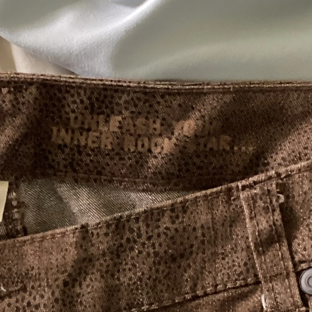 Avenue jeans in Dark brown animal print with functional zippers at ankle 18W